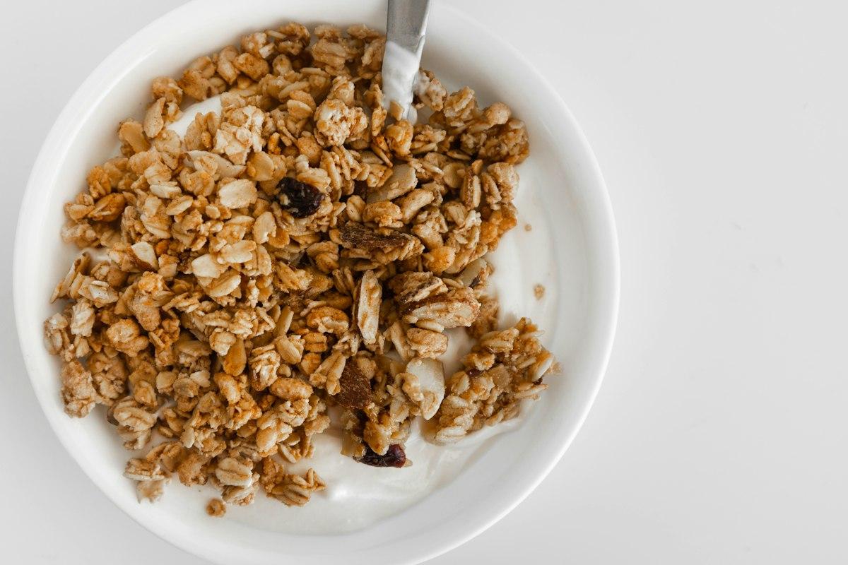 Bowl of crunchy granola with a spoon