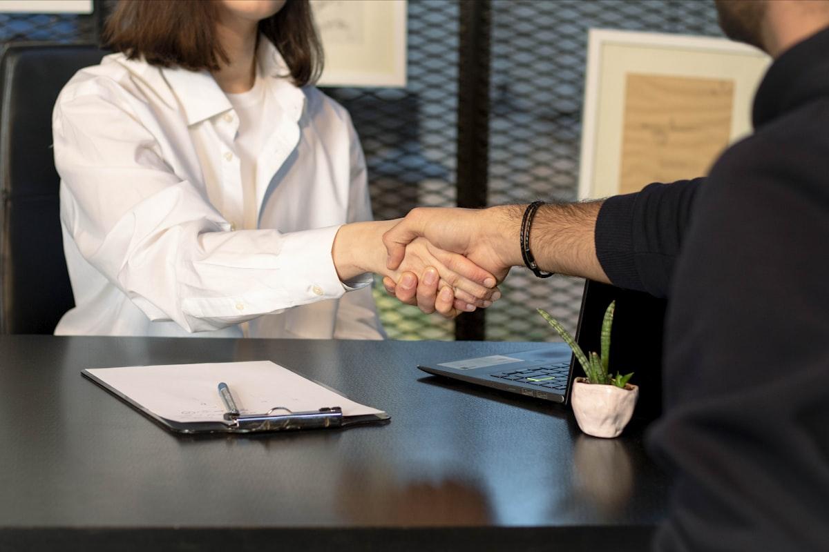 Handshake between two business partners in an office